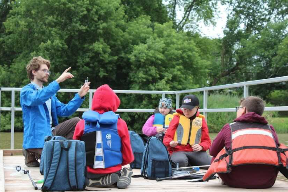 Luke, Water Rangers' previous Education Coordinator, teaching water quality sampling at South Nation's fishing Camp